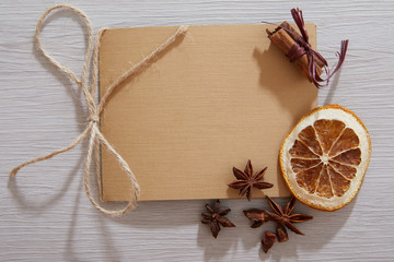 Blank paper on wood table. Vintage table top with blank paper. Old white wooden boards and blank paper. Top view of blank paper page on wood background office desk and different objects. Flat lay.