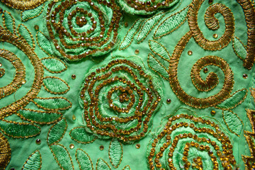 Floral Embroidery Design on Perot Green Fabric/Cloth Background