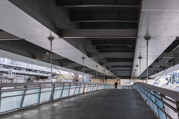 The road under the bridge. Urban architecture. Tunnel.