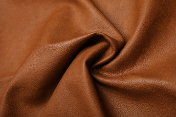 Piece of crumpled leather as background, top view