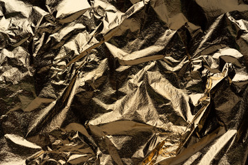 crumpled sheet of gold. abstract relief material