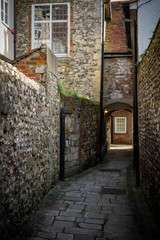 Fototapeta na wymiar A old cobbled alleyway in the back streets of Chichester west sussex