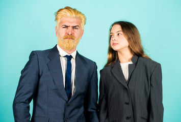 businessman dyed blond hair. small girl in oversized jacket. choosing future career. family business startup. kid in business school. father and daughter in suit. modern office life