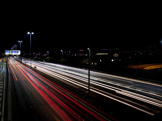 Fototapeta na wymiar Light trails of cars at night on a Motorway or freeway