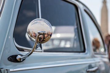 the chrome wing mirror on a vintage car