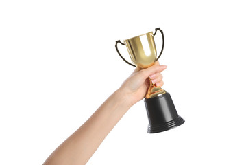 Woman holding gold trophy cup on white background, closeup