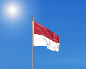 3D illustration. Colored waving flag of Indonesia on sunny blue sky background.