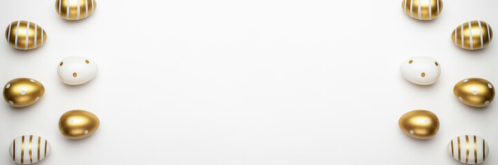 Happy Easter golden shine decorated eggs in basket isolated on white background. For greeting card, promotion, poster, flyer, web-banner, article.