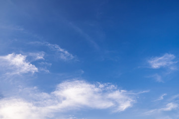 Blue sky background with tiny clouds. white fluffy clouds in the blue sky