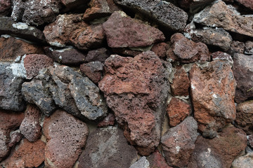 Stacked colored volcanic rocks closeup