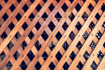 Diagonal crossed wooden planks background. Wooden battens Background. Old lath overlap.