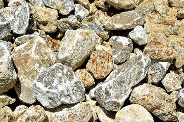 Natural gray gypsum stones. Gypsum stone is a soft sulfate mineral composed of calcium sulfate dihydrate. Industrial mining area. Limestone quarry with  crystals of selenite.
