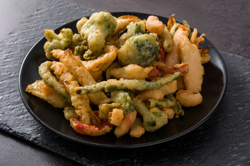 Japanese vegetable tempura on black background