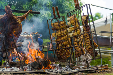 Meat and vegetable exhibition on a barbecue known as Parrilla. Typical barbecue from the south of Latin America.