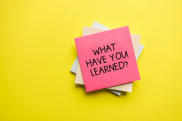 What Have You Learned? Note Paper on Yellow Background.