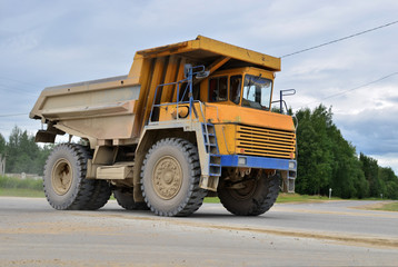 Big mining truck transport of minerals in the quarry. Open-cast mining  of extracting rock or minerals from the earth. Largest dolomite deposit open-pit mining Gralevo, Belarus, Vitebsk region