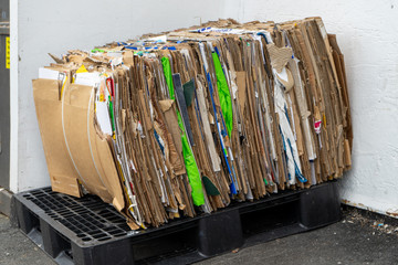 a stack of compacted cardboard ready to be recycled