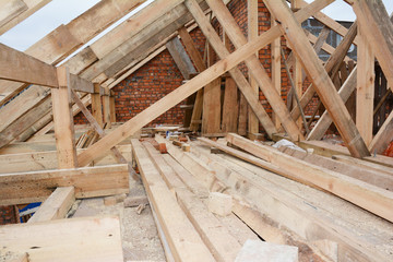 Roofing construction with wooden frame beams, trusses, rafters