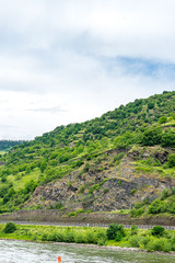 Germany, Rhine Romantic Cruise, a close up of a hillside next to a body of water