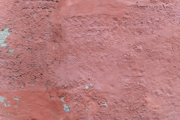 Old plaster background texture of light red wall
