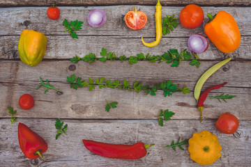 Vegetables on a wooden Board: bell pepper, red chili pepper, tomato, peas in a pod, onion, parsley, herbs, pumpkin, Pattison. Selling vegetables.Vitamins.Photo.