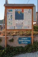 Kallithea, Greece - September 03,2019: Information board for Community of Kallithea. Kalithea Beach (Greek: &Pi;&alpha;&rho;&alpha;&lambda;ί&alpha; &Kappa;&alpha;&lambda;&lambda;&iota;&theta;έ&alpha;) the most beautiful beach in Kallithea, Halkidiki in Greece.