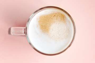 a cup of homemade hot milky coffee with empty space for text. Vivid bright colors