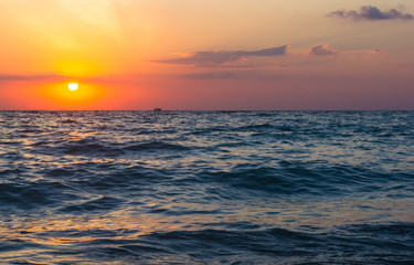 Amazing sea sunset, the sun, waves, clouds