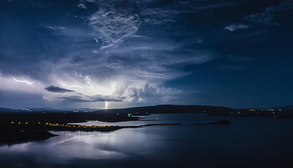 Fototapeta premium Lightning over the lake