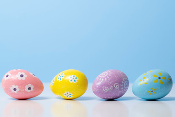 Painted Easter eggs on a colorful background