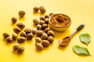 Nutmeg - still life with asian spices - on yellow background