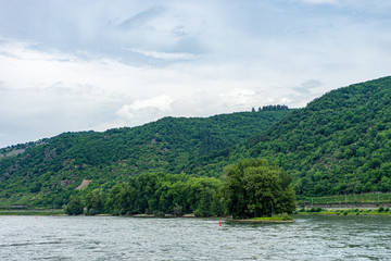 Germany, Rhine Romantic Cruise, a body of water with a mountain in the background
