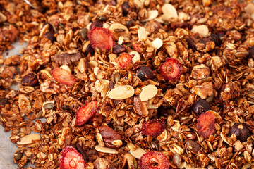 Fresh granola, muesli with dried strawberries, nuts,cranberries and  honey
