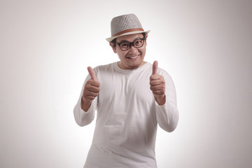 Fototapeta premium Young Man Showing Thumbs Up Gesture OK Sign
