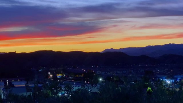 Vibrant sunset time lapse above cityscape of Santa Clarita, California