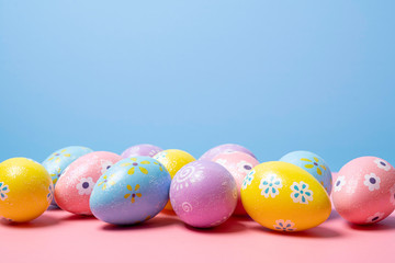 Painted Easter eggs on a colorful background