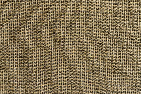 Linen fabric of brown color with visible weave texture. Expensive natural suit. High resolution