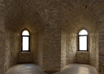 Photo of two old ancient windows in stone castle in Ukraine