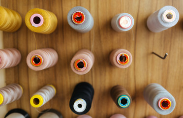 Sewing threads as a multicolored background close up