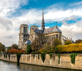 Fototapeta na wymiar Beautiful Notre-Dame de Paris cathedral with a Gothic spire several month before the fire in colorful autumn season, Paris, France