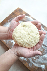 the dough in men's hands