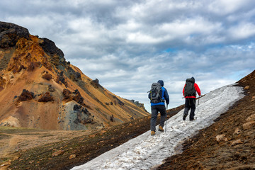 Fototapeta premium Hikers going up the mountain