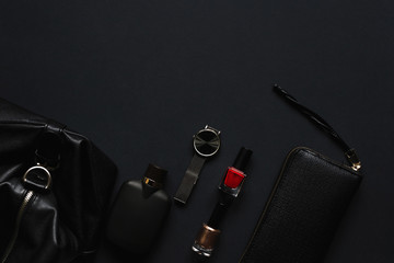 Accessories for women's beauty. Make up brush, watch, nail polish and hair straightener, all on a...