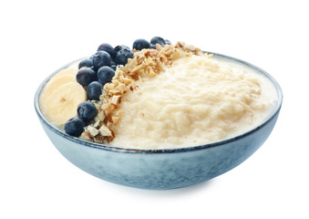 Delicious rice pudding with banana, blueberries and almond isolated on white