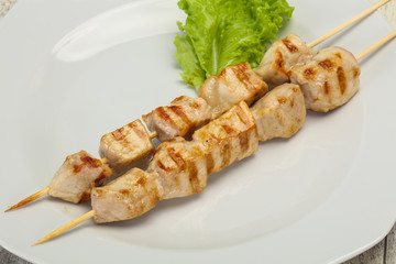 Grilled pork skewer served salad
