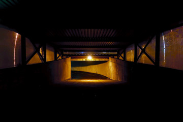 Entrance to the underground garage lit by a single dim light