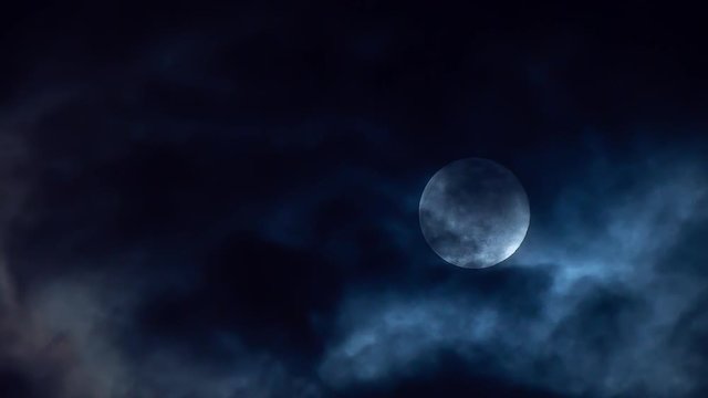 Dramatic Full Moon With Clouds at Night