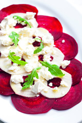fresh beetroot and apple salad with fresh goat cheese and arugula