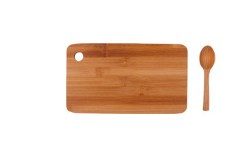 Kitchen cutting board and wooden spoon.
