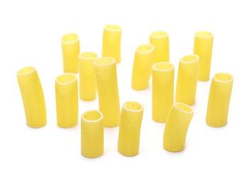 Uncooked smooth short tubes shape pasta also known as tubetti lisci isolated on white background